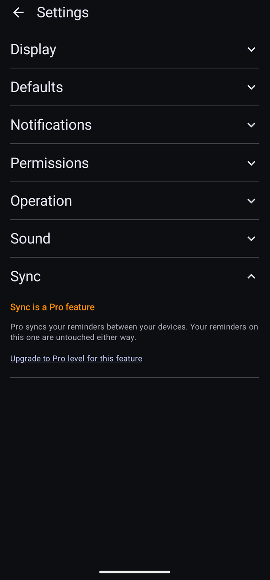 The Settings screen with the Sync section expanded on Free. It reads “Sync is a Pro feature”, explains that Pro syncs your reminders between your devices and that the reminders on this one are untouched either way, and offers the link “Upgrade to Pro level for this feature”.